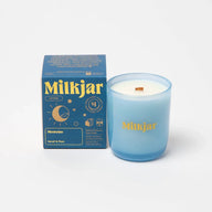 Translucent light blue coconut soy milkjar candle with wooden wick and gold lettering in moonrise neroli plum scent
