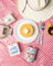 Golden pancake with butter on a white plate with blue floral trim featured on a pancake breakfast 8oz soy candle