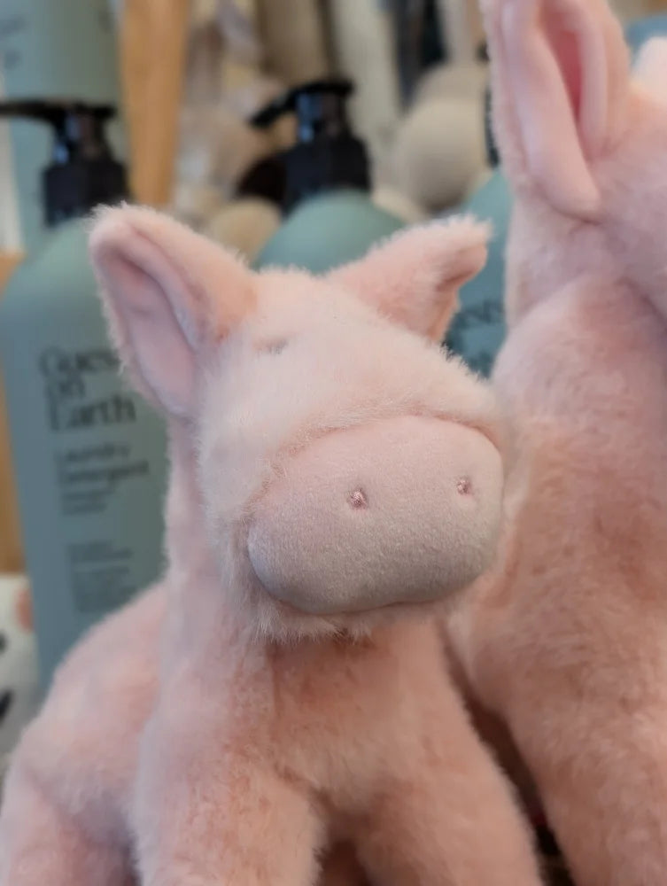 A large size pink piggies plush toy with soft fuzzy texture and small embroidered eyes perfect for cuddling