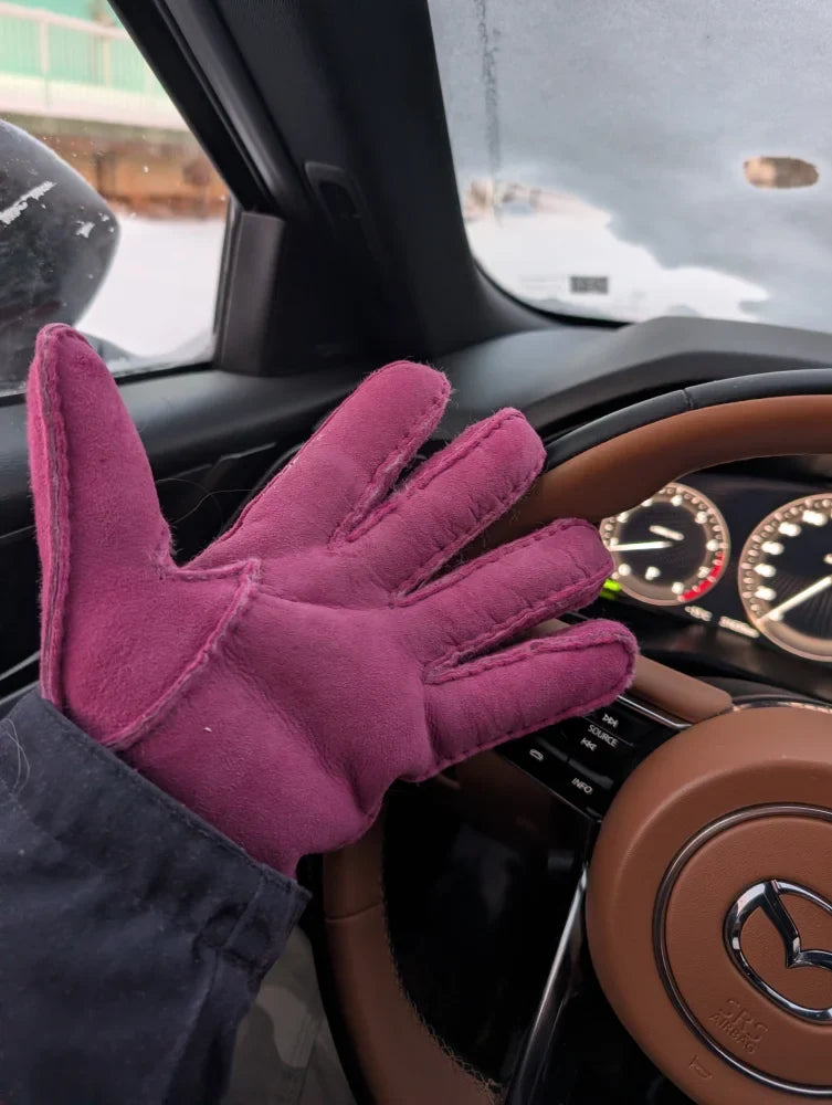 Plush pink sheepskins gloves in magenta suede with visible stitching
