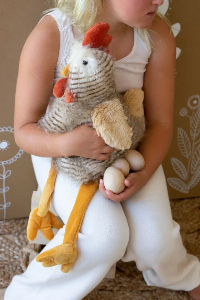 A plush stuffed chicken named Rupert the Rooster with a striped gray and white body and soft beige wings