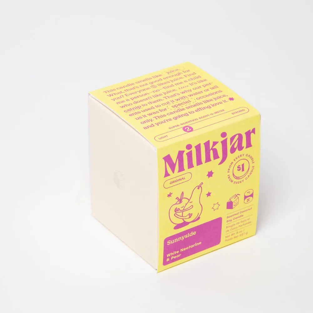 Bright yellow cardboard box with purple text for sunnyside pear and nectarine coconut soy candle smells jar packaging