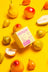 A pastel pink cream sunnyside pear nectarine coconut soy candle box with cute cartoon labeled strawberry flavor candle smells