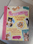 A vibrant pink and yellow cat sticker book titled the cats meow featuring playful cat illustrations by megan lynn kott