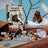 A whimsical trash bandits sticker book with raccoons bears and birds interacting with trash on the colorful cover