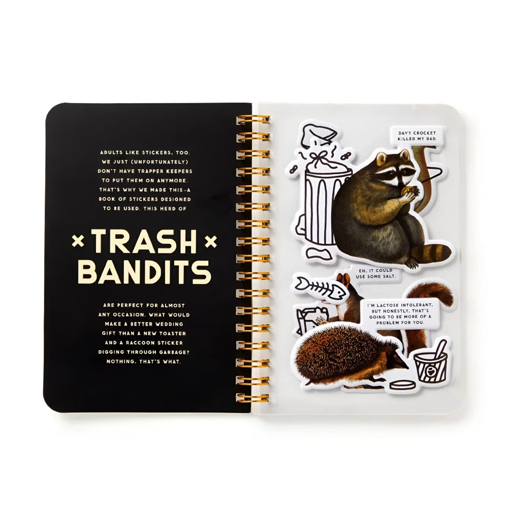 Gold spiral-bound trash bandits sticker book with funny raccoon and hedgehog bandits sticker illustrations and captions