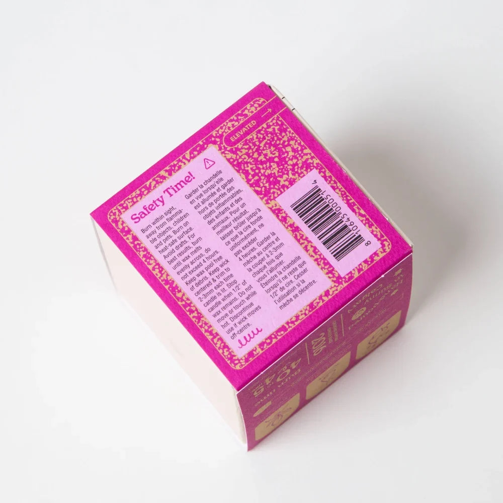 Vibrant pink wallflower tobacco and peony coconut soy candle box with gold foil and safety instructions on back side