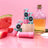 Pink and teal watermelon natural lip balm tubes with black circular branding perfect for moisturizing lips