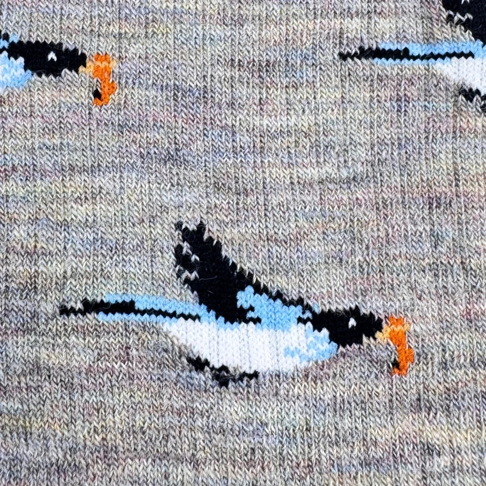Gray merino wool socks with stylized black white and blue birds and orange beaks for women and moms outdoor fun