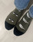 Olive green merino wool crew socks with black toe caps and white bird and glasses designs for all-season wear
