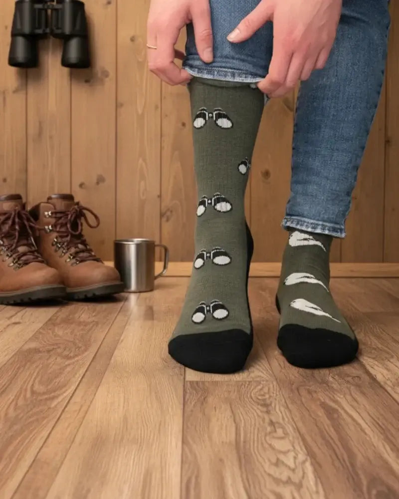 Women’s olive green merino wool knee-high socks with playful white binocular patterns and black toe caps for all-season wear