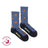 Women’s blue heathered merino wool socks with orange monarch butterfly prints and friday sock co branding on heel