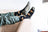 Black womens merino wool cabin socks with golden starry spaceship pattern and gray toe caps for outdoor fun