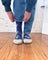 Women’s blue merino wool socks with yellow white bird designs and light gray toe cap perfect for fun outdoor camping