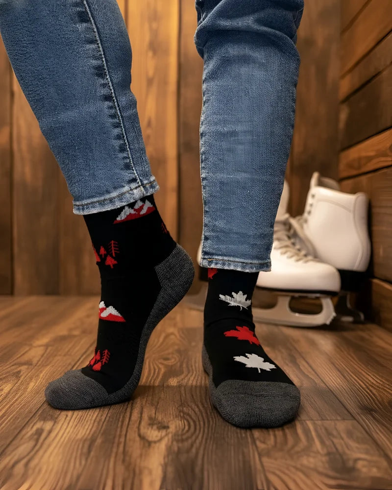 Women’s canada merino wool socks in black with red and white maple leaf patterns, gray toes, perfect for hiking