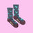 Dark gray heathered women’s merino wool socks with turquoise hummingbirds red flowers and maroon toe caps and heels