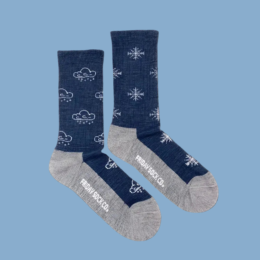 Women’s winter merino wool socks in navy blue with white clouds and snowflakes, gray toes and heels by angus oliver