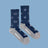 Women’s winter merino wool socks in navy blue with white clouds and snowflakes, gray toes and heels by angus oliver