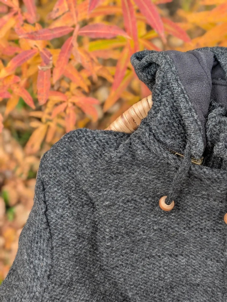 Cozy dark gray woolen calgary cardigan with zealand wool, attached hood, wooden toggles, and soft fleece lining