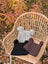 Three woolen heelah double pompom hats in gray black and brown with double pompoms perfect for cold weather