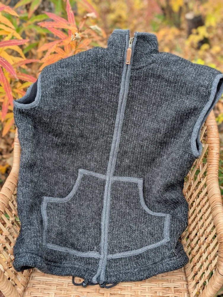 Dark gray woolen jasper vest with lighter gray zipper and pocket trim made from soft fleece zealand wool