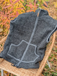 Dark gray woolen jasper vest with ribbed knit, full zipper, matching pocket trim made from soft fleece zealand wool